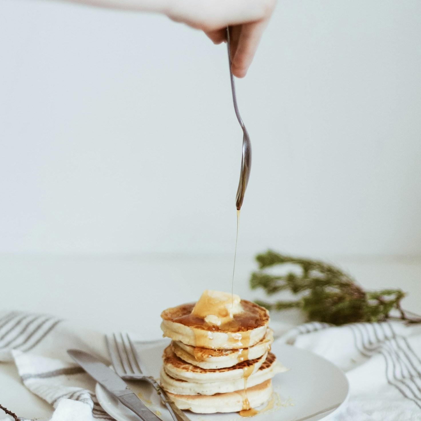 Diverse group of community members sharing a meal together, highlighting the bonds formed through collaborative cooking